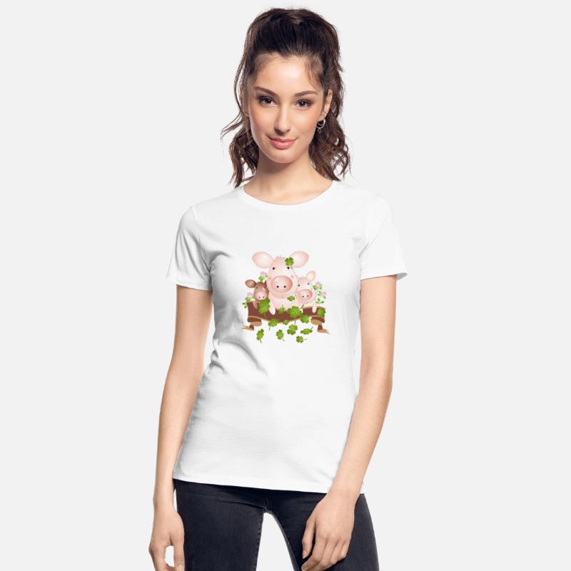 three lucky pigs with four-leaf clovers