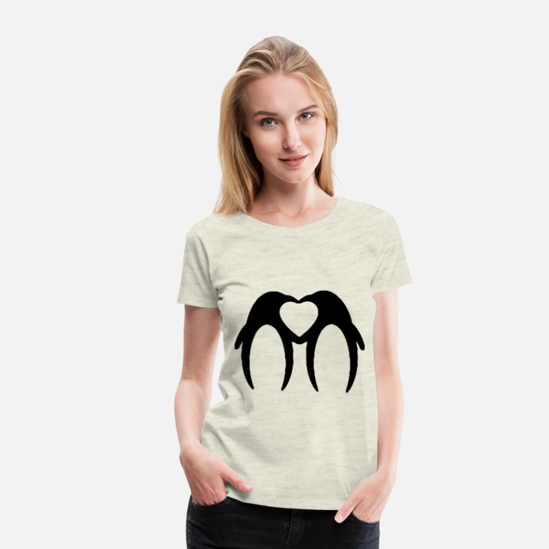 Two penguins form a heart