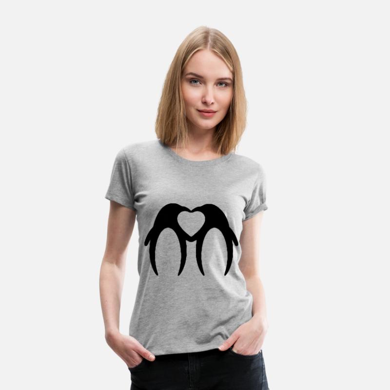 Two penguins form a heart