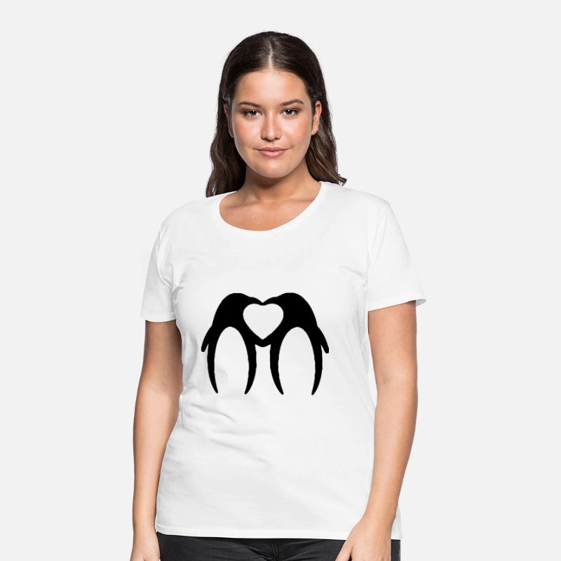 Two penguins form a heart