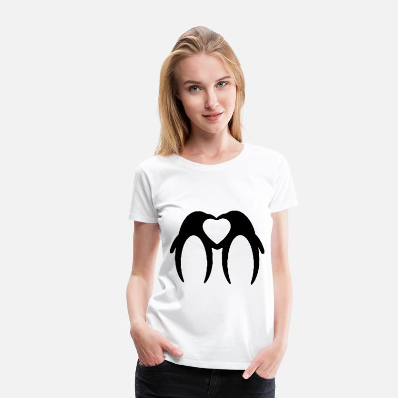 Two penguins form a heart